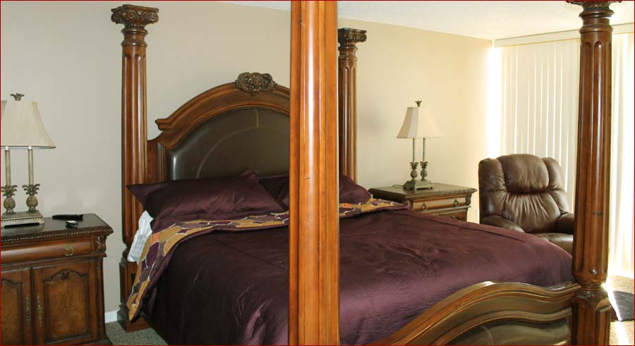Sunny gulf front master bedroom with a king sized bed and private HDTV.
