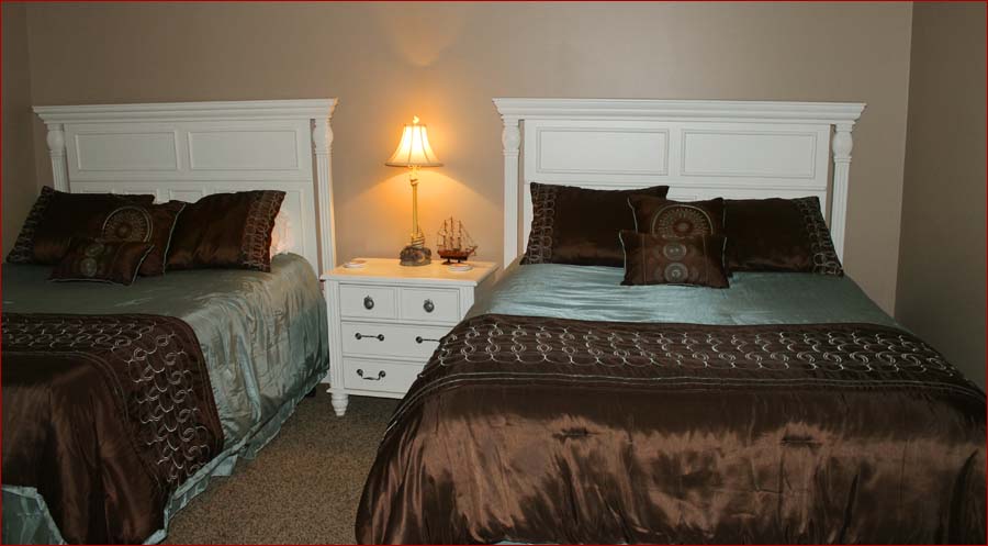The third bedroom includes 2 queen beds, private bath and HDTV.